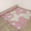Tapis rose (motifs papillon)