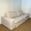 Grand canapé en tissu beige dépliable