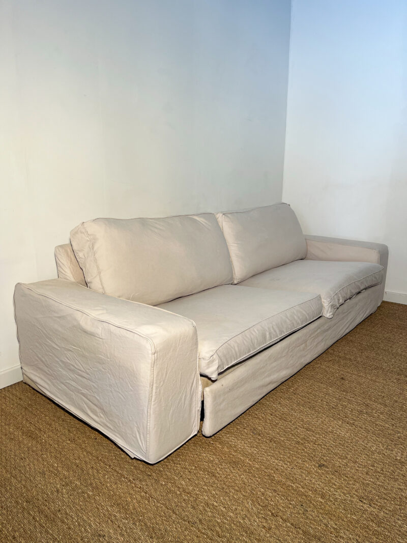 Grand canapé en tissu beige dépliable